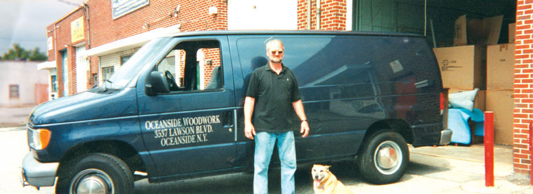 Marty Maher with his dog Betsy at Oceanside Woodwork